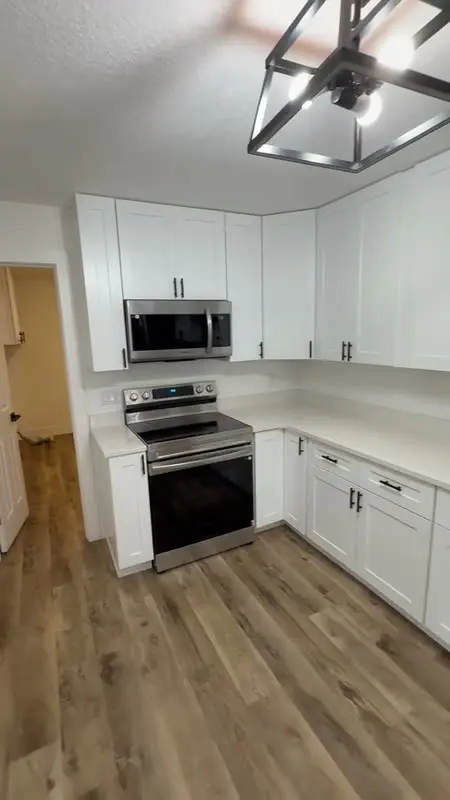 Remodeled kitchen with white cabinets
